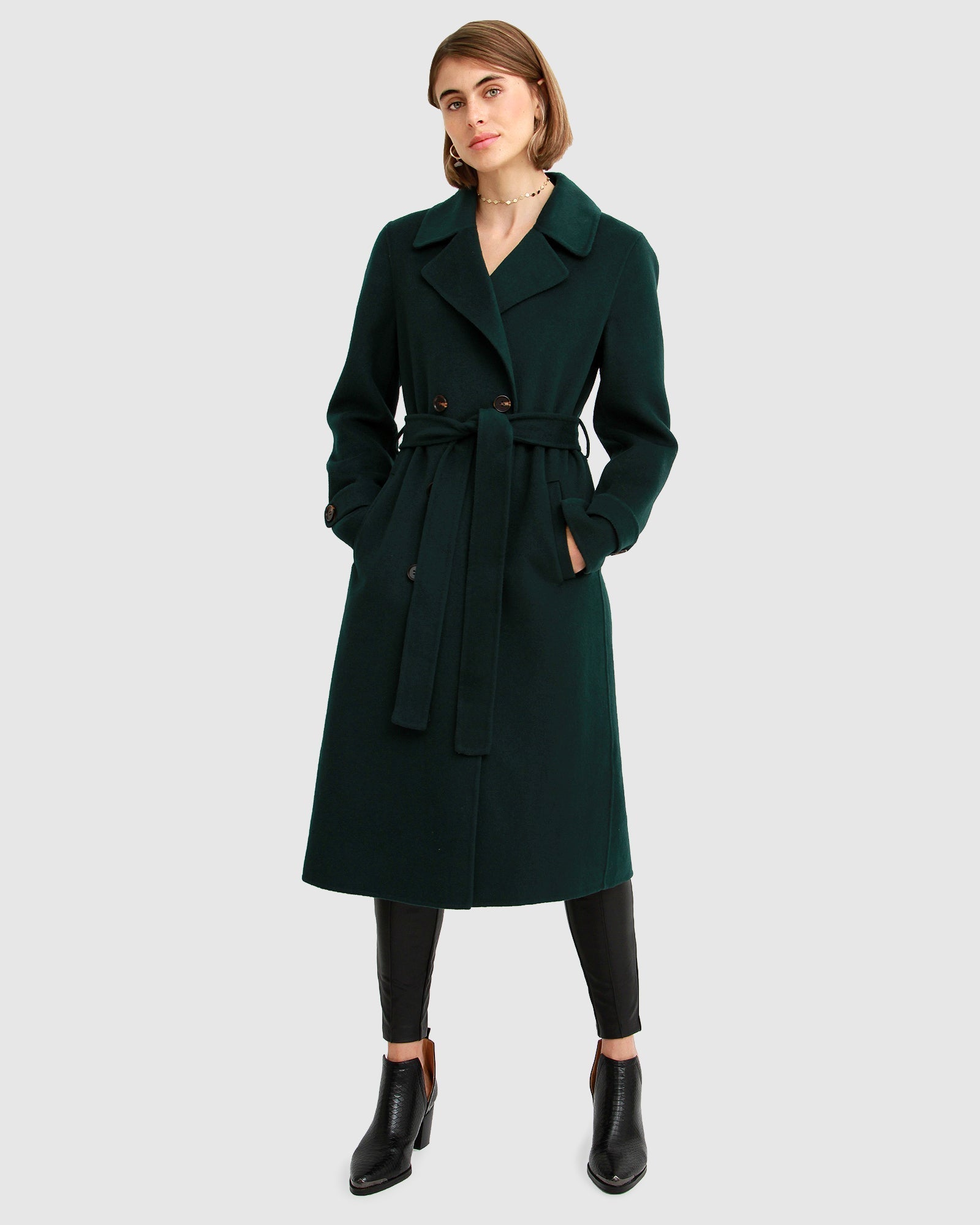 Dark green store duster coat